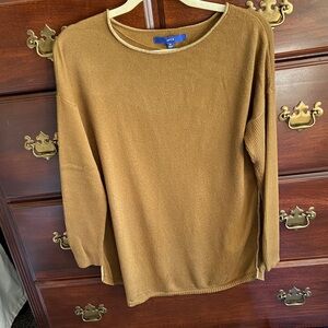 A mustard colored fine knit pullover sweater. Size M